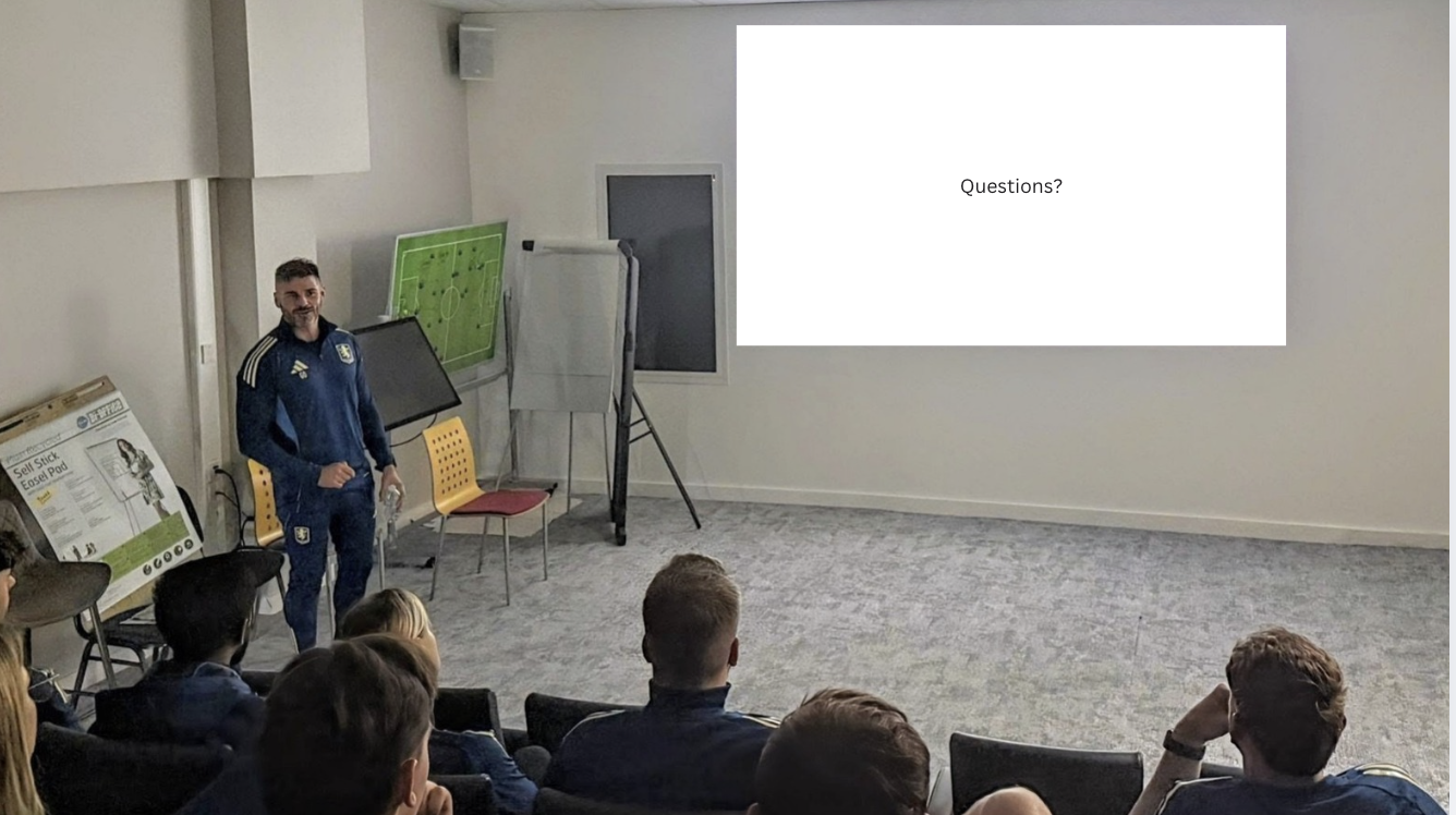 Gareth O'Neill presenting to a team during a Q&A session